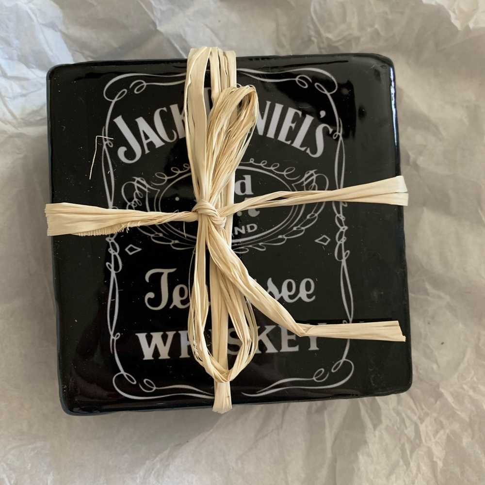 4 glass Jack Daniel coasters